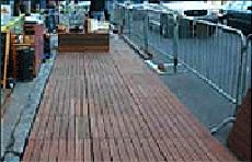 Wooden decking along a sidewalk