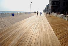 A boardwalk with people on bicycles
