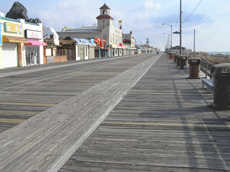 Coastal boardwalk with shops on the left