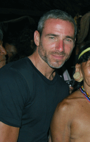 Man in black shirt standing next to indigenous woman