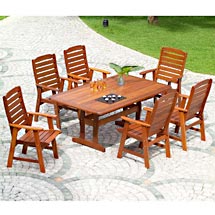 A dining set of furniture on a patio.